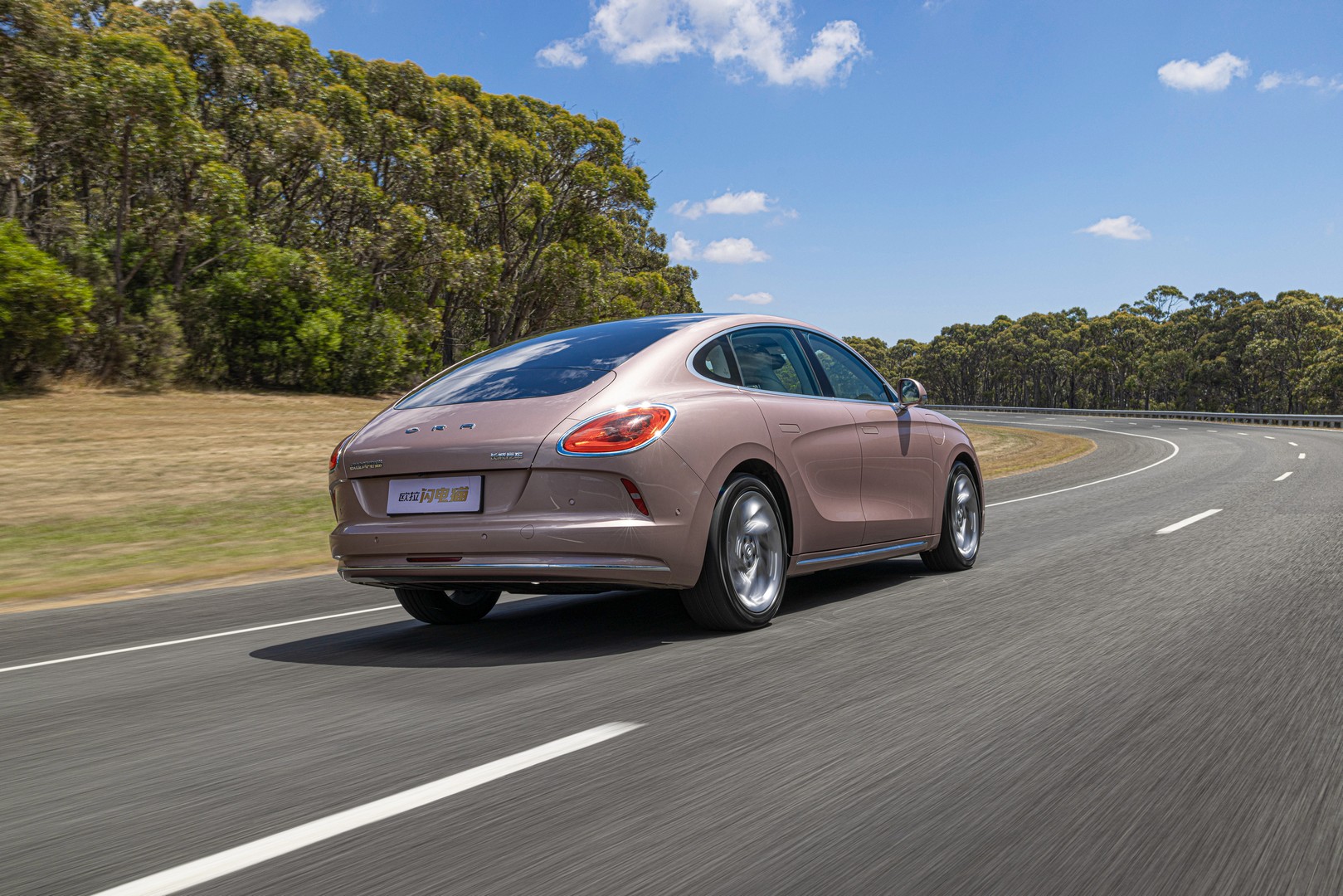 GWM Ora Sport driving on an oval test track in Australia.