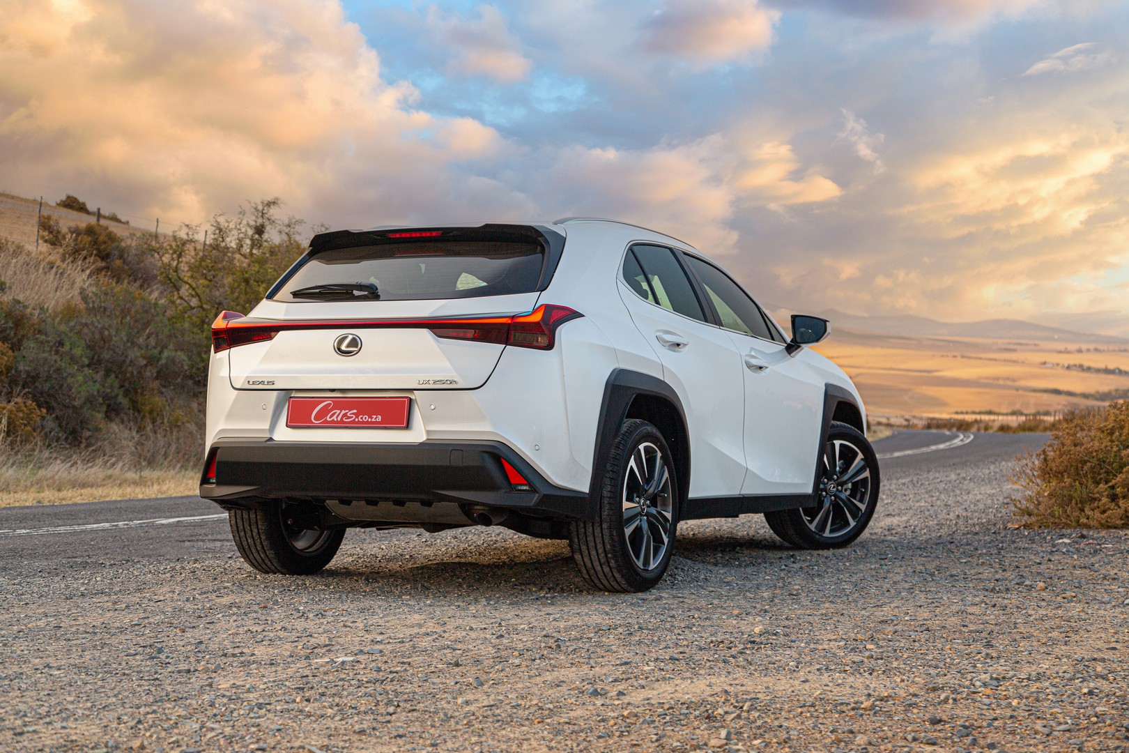 2023 Lexus UX 250h EX rear three-quarter view.