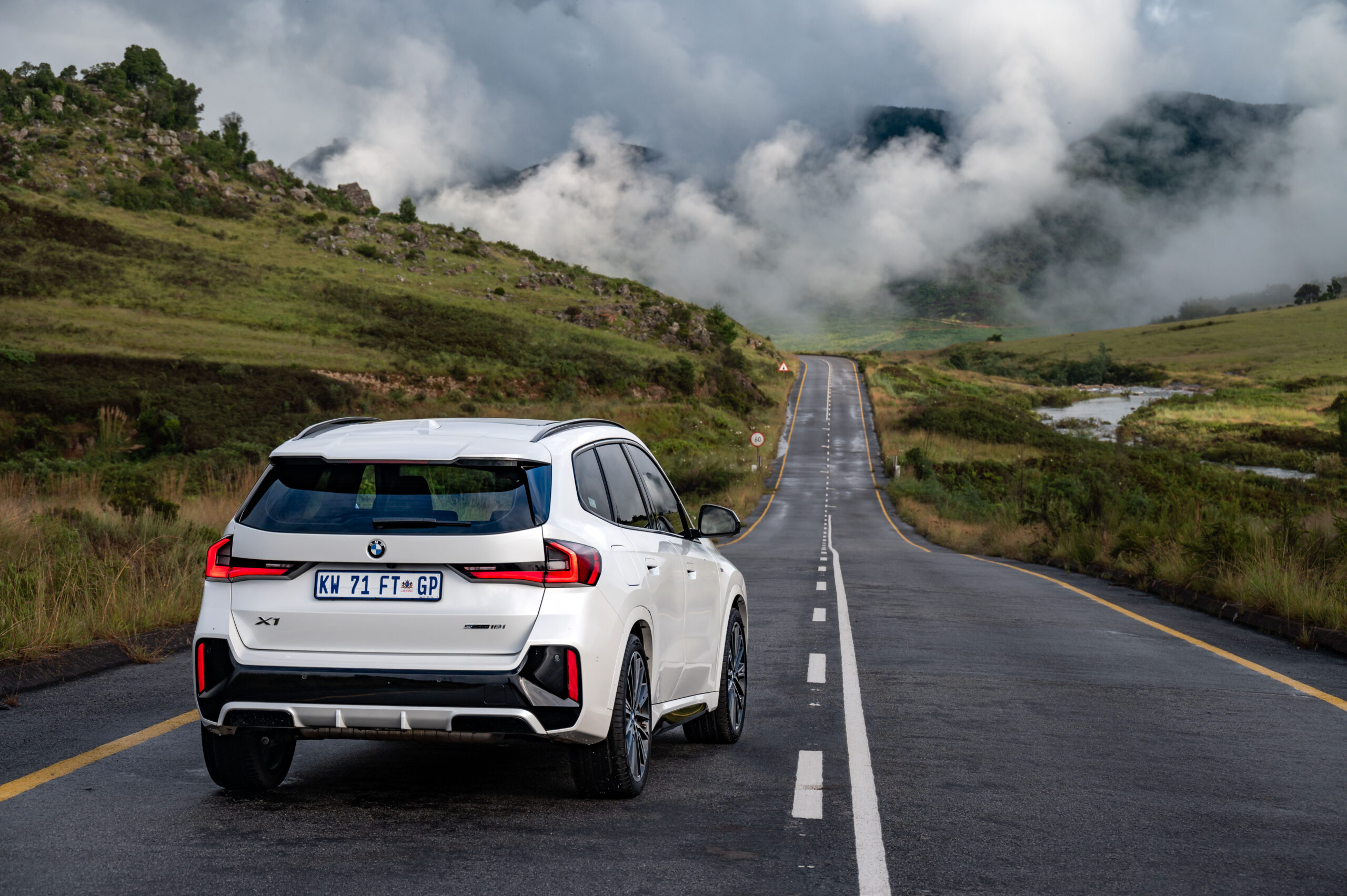 Rear aspect of new BMW X1 (2023), photographed on a country road.