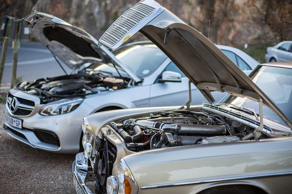 The engine compartments of the Mercedes-Benz E63 AMG and 300SEL 6.3