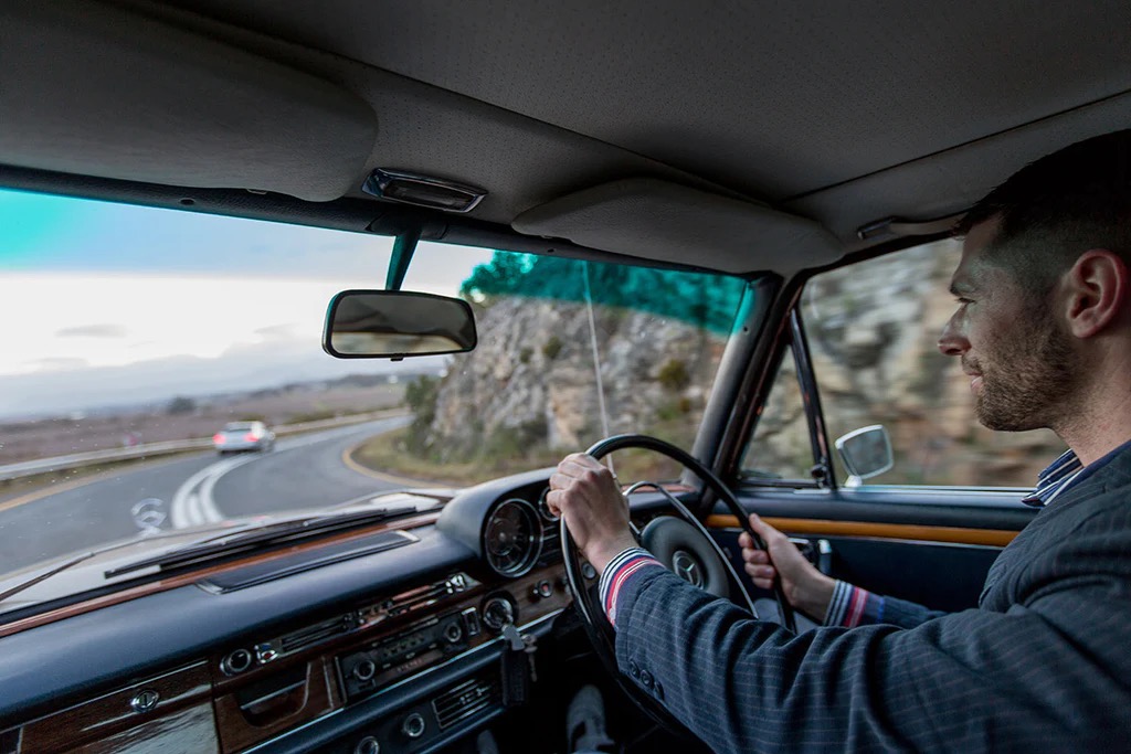 At the 'wheel of the Mercedes-Benz 300SEL 6.3
