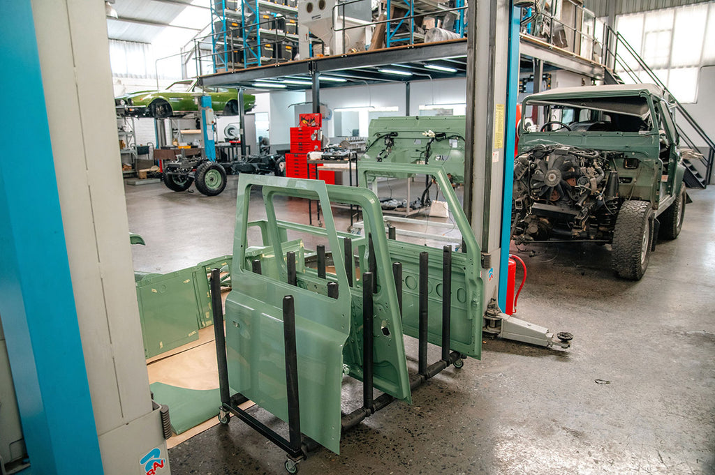 Land Rover doors stacked at the Journeymen Workshop in Cape Town