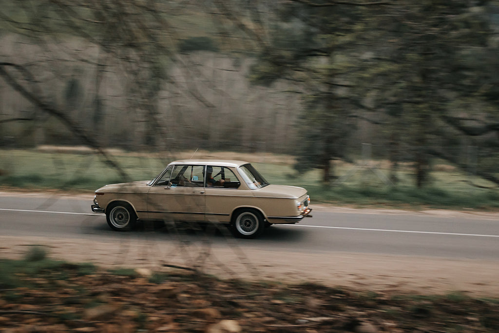 BMW 2002tii profile tracking shot