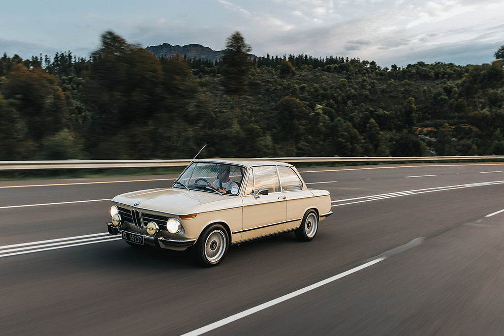 BMW 2002tii front three-quarter tracking shot