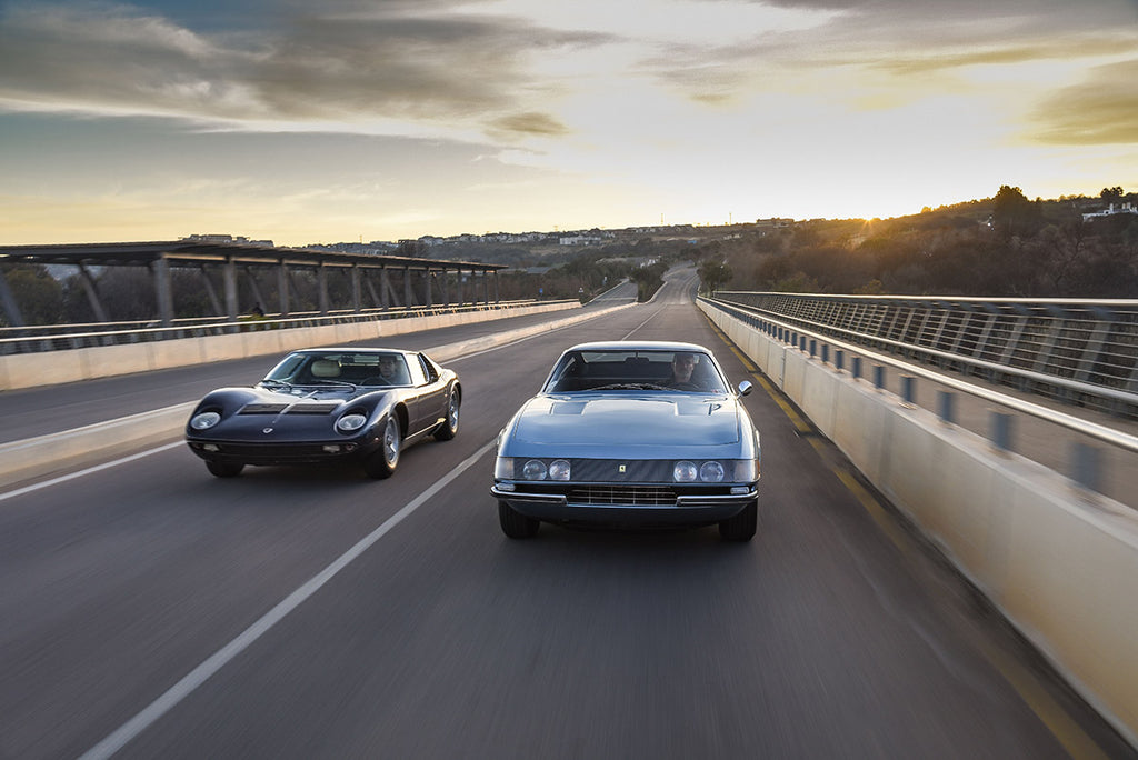 Ferrari Daytona (right) flanked by a Lamborghini Miura, front tracking shot