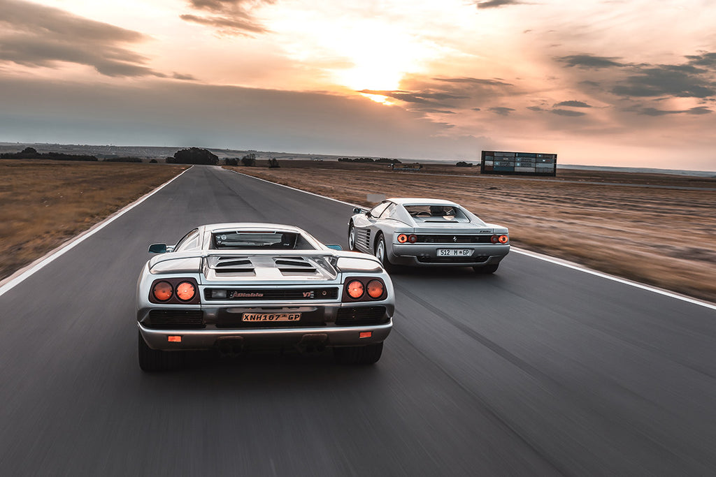 Lamborghini Diablo (left) and Ferrari F512 M rear tracking shot