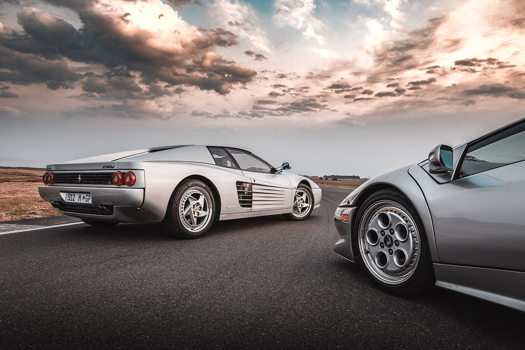 Ferrari F512 M (left) and Lamborghini Diablo parked side-by-side.