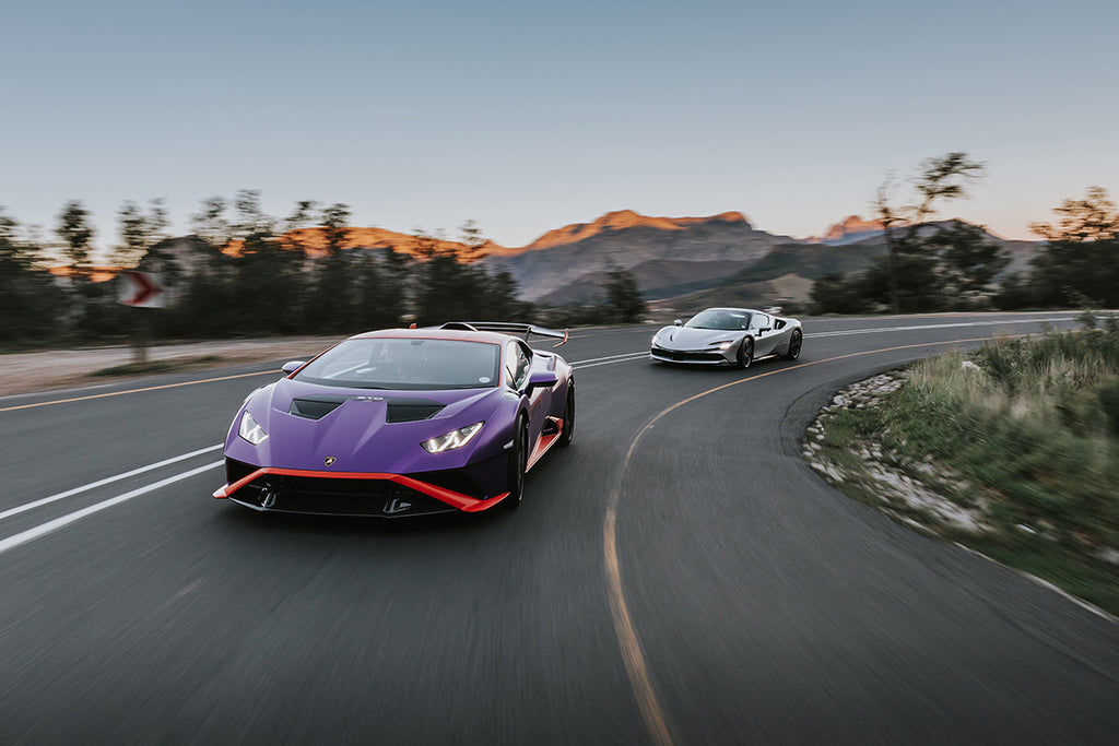 Lamborghini Huracan STO (left), followed by a Ferrari SF90 Spider on Franschhoek Pass. 