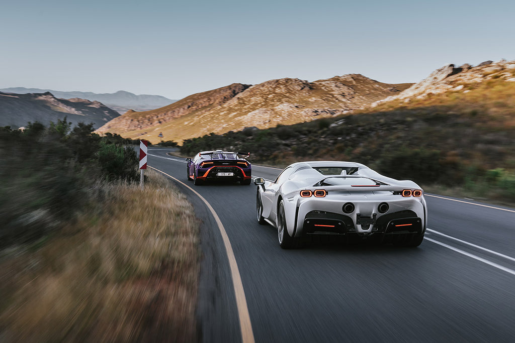 Lamborghini Huracan STO (left) and Ferrari SF90 Spider rear tracking shot