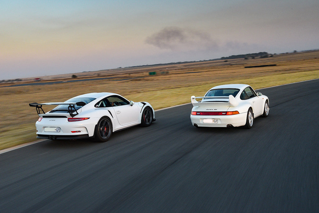 Porsche 911 (991.1) GT3 RS (left) and Porsche 911 (993) Carrera RS, rear tracking shot
