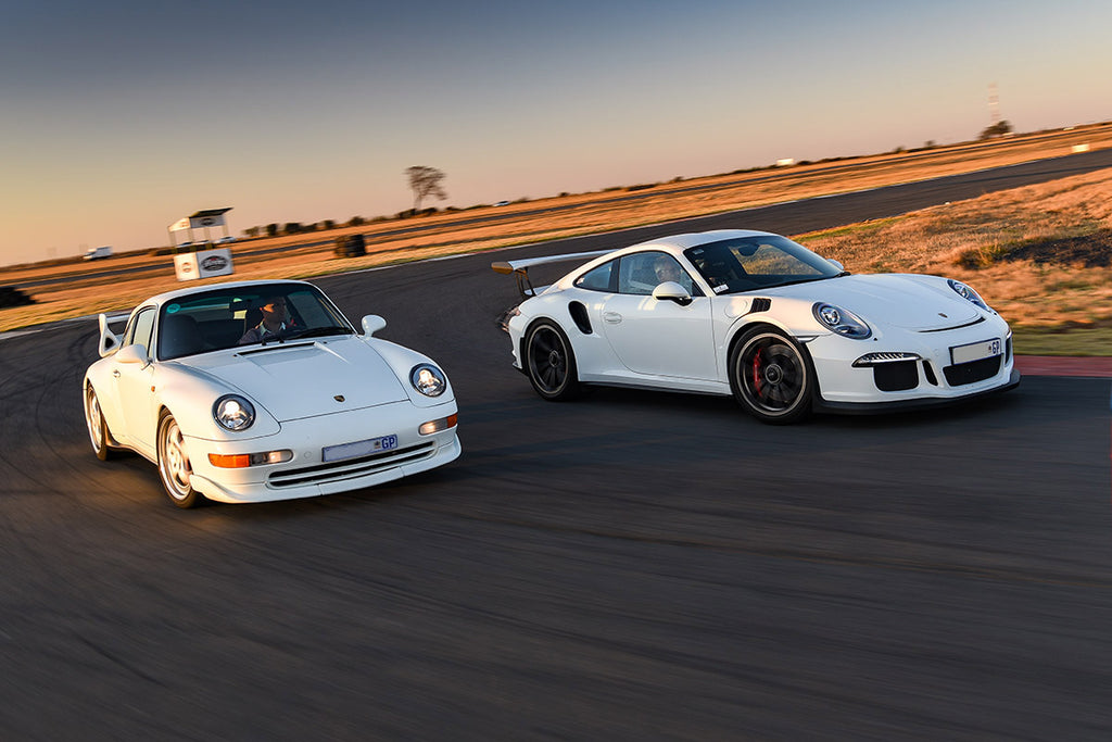 Porsche 911 (993) Carrera RS (left) and Porsche 911 (991.1) GT3 RS front tracking shot 