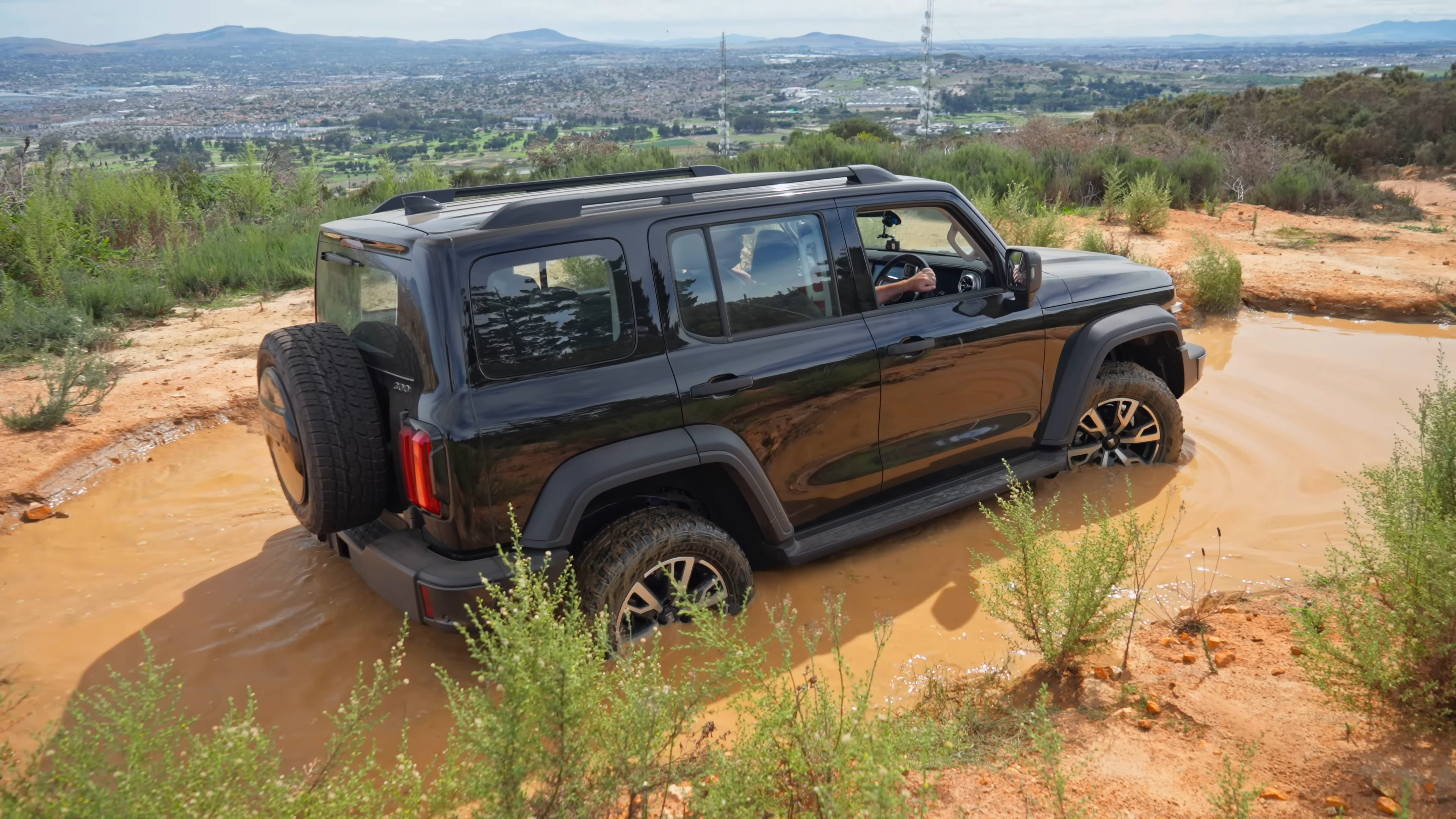 GWM Tank 300 Diesel going through a water obstacle on a 4x4 course